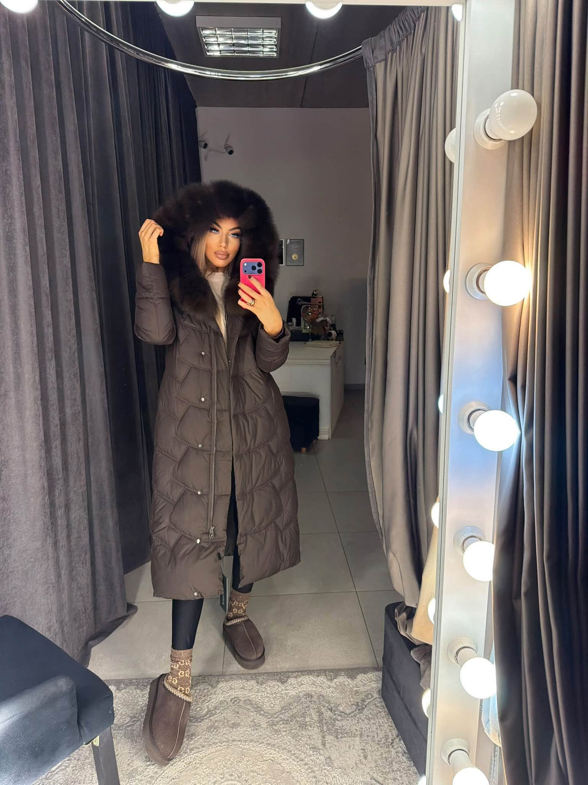Long brown quilted coat with natural fur hood up and belted waist